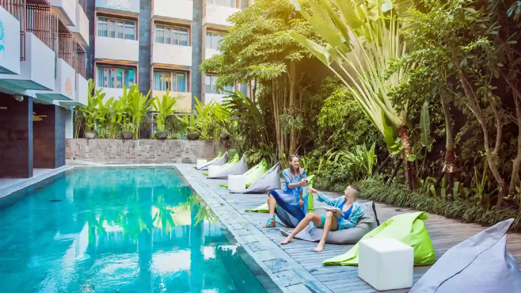 Outdoor swimming pool and sun loungers at Boutique Seminyak Hotel Bali