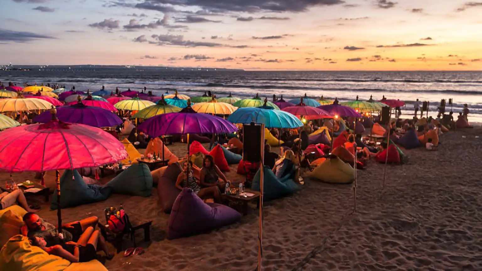 Visitors enjoying sunset at Seminyak Beach in Bali